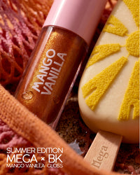 Close-up of Mango Vanilla Juicy Bloom Gloss with warm-golden shimmer beside a mango-toned Mega treat